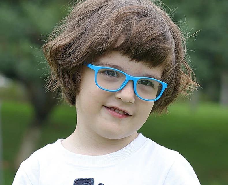 Example photo of a smiling child in blue glasses